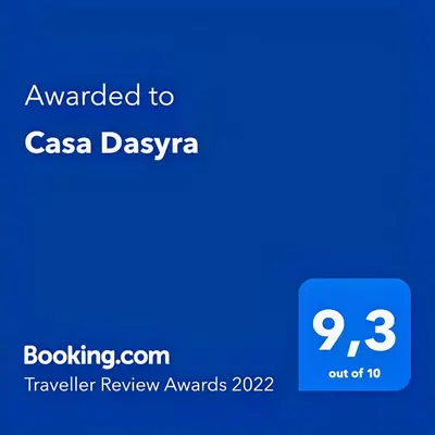 a blue sign with the text awarded to casa dasyza at Casa Dasyra in Chania Town