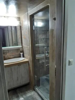 a bathroom with a shower and a sink at Utsi in Liyidhés