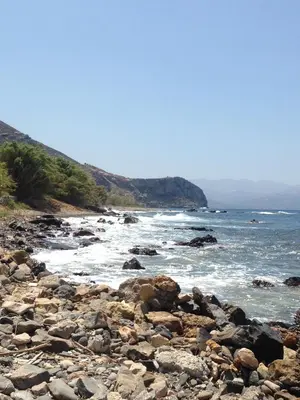 a rocky beach with the ocean in the background at Dream House Efi in Ravdhoúkha