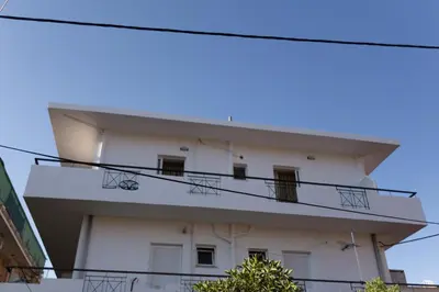 a building with balconies on the side of it at Nicky Apartments Chania in Chania Town