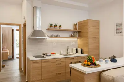 a kitchen with a sink and a counter top at Blue Jasmine Apartments in Chania Town