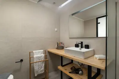 a bathroom with a white sink and a mirror at 