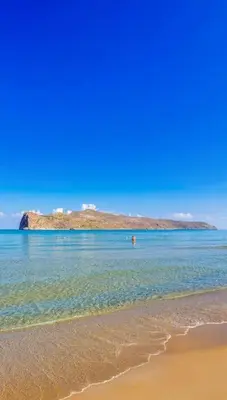 a beach with an island in the water at 