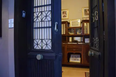 a blue door in a room with a desk at Chania 1548 Old Town Apartments in Chania Town