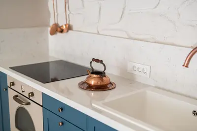 a tea kettle sitting on top of a kitchen counter at Cretan Soul in Plataniás