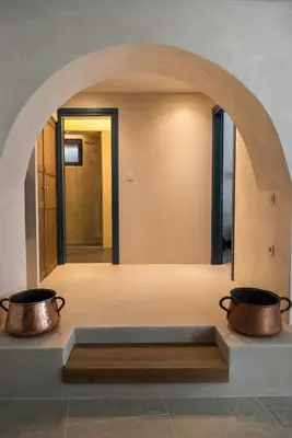 two pots on a counter in a room with an archway at Cretan Soul in Plataniás