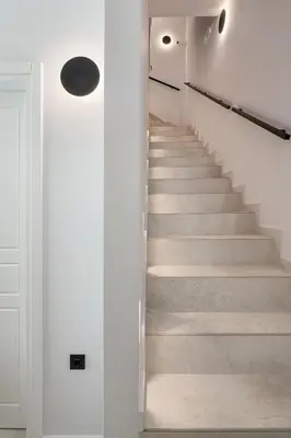 a staircase in a house with white walls and concrete floors at Camere Maritima in Chania Town