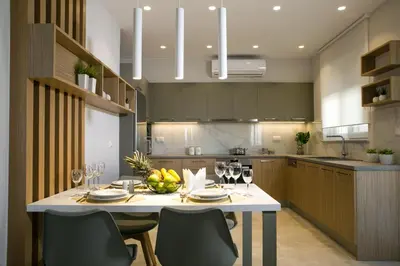 a kitchen with a white table with wine glasses at Limosa Luxury Residences in Kissamos