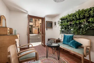 a living room with a couch and a table at Agazade Bey in Chania Town