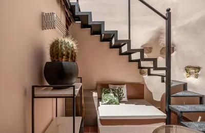 a staircase in a room with a cactus at Agazade Bey in Chania Town