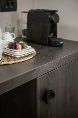 a plate of food on a counter next to a microwave at Anaem Eclectic Rooms in Chania Town
