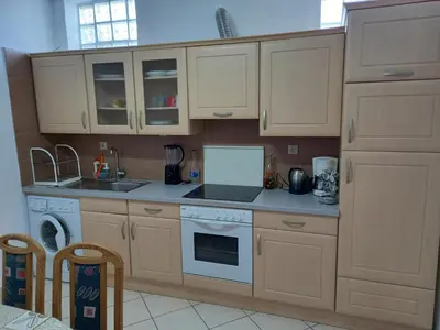 a kitchen with a sink and a stove top oven at Alexandros cosy house for family vacation in Chania Town