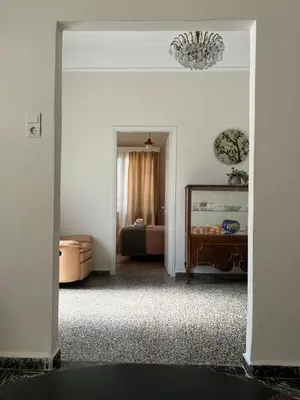 a living room with a mirror and a couch at Reina House in Chania Town