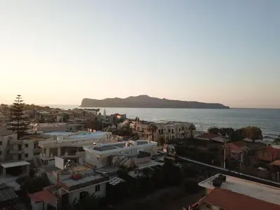 an aerial view of a city and the ocean at Erotokritos Studios near the beach in Agia Marina Nea Kydonias