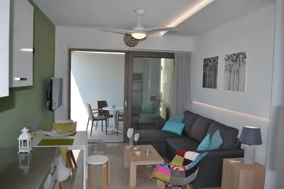 a living room with a couch and a table at Filia Luxury Apartments in Chania Town