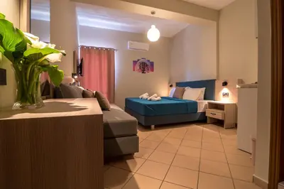 a living room with a couch and a bed at Libyan Sunrise in Palaiochóra