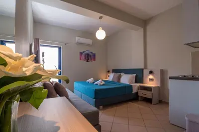 a living room with a couch and a bed at Libyan Sunrise in Palaiochóra