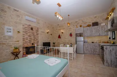 a kitchen with a blue table in a room at La casa de Ioanna in Kissamos
