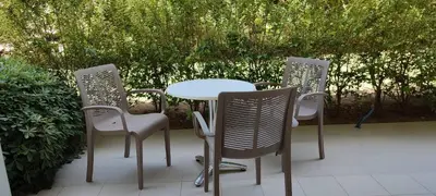 a table and four chairs sitting on a patio at Kyriaki Hotel in Kato Daratso