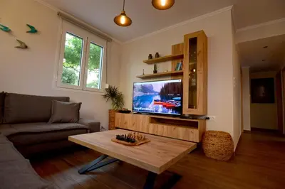 a living room with a couch and a coffee table at Bitsakis Family - Paleochora Luxury Villa in Palaiochóra