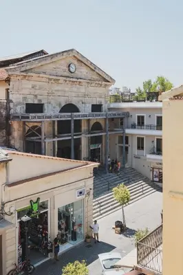 an old building in the middle of a city at Home with Terrace in Heart of old Town of Chania in Chania Town