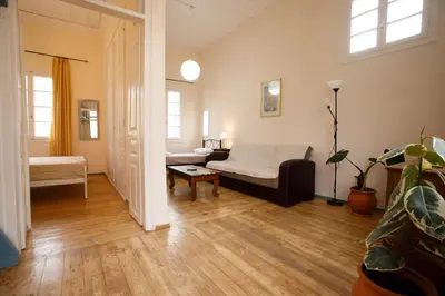 a living room with a couch and a table at Home with Terrace in Heart of old Town of Chania in Chania Town