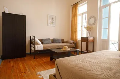 a living room with a couch and a table at Home with Terrace in Heart of old Town of Chania in Chania Town