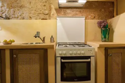 a kitchen with a stove and a sink at History and Charm in Chania Town