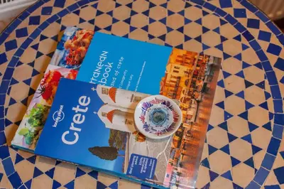 two books sitting on top of a table at History and Charm in Chania Town