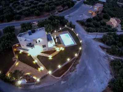 an aerial view of a house with a swimming pool at Horizon Villa Almyrida in Almirida