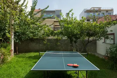 a ping pong table in the middle of a yard at Peraspitaki in Chania Town