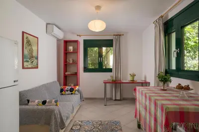 a living room with a couch and a table at Peraspitaki in Chania Town