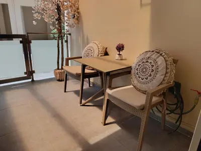 a dining room with a table and two chairs at Apolafsi Apartments 2 New with kitchen in Chania Town