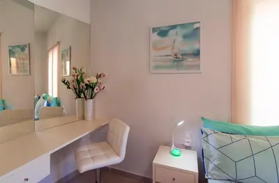 a room with a desk and a chair with flowers at Apolafsi Apartments 1New with kitchen in Chania Town