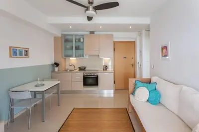 a living room with a couch and a table at Sea & Town Getaway in Chania Town