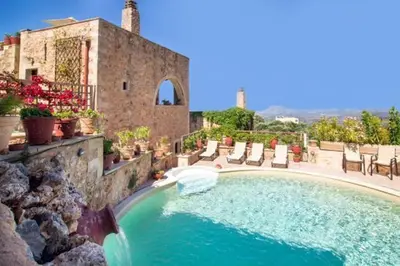 a swimming pool in front of a house at Traditional Crete Villa Villa Green Faskomilia Stunning Views 1 Bedroom in Khiliomoudhoú