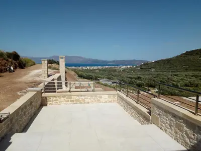 a stone walkway with a view of a mountain at Villa Stylianos retreat in Kissamos