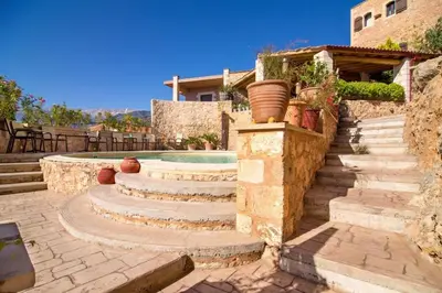 a set of stairs leading to a swimming pool at Traditional Crete Villa Villa Blue Mantzourana Stunning Views 1 Bedroom in Khiliomoudhoú