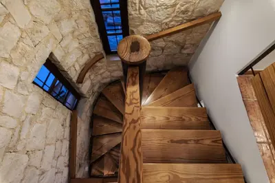 a staircase in a building with a stone wall at Luxury Crete Villa Villa Koukounari Private Pool Beautiful Scenery in Chania Town