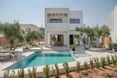 a villa with a swimming pool in the desert at Anthos Villas - Chania in Tavronitis