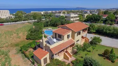an overhead view of a house with a swimming pool at Exclusive Crete Villa Villa Alexia 4 Bedrooms Large Lawned Gardens in Maleme