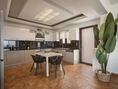 a kitchen with a table and chairs and a potted plant at Villa Anemeli - Luxury pool villa with gorgeous seaview in Kissamos
