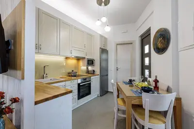 a kitchen with a table and a dining room at Villa Chryssi in Kissamos