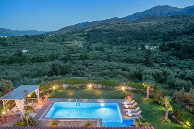 an overhead view of a swimming pool in a yard with mountains at Villa Kalithea in Pemónia