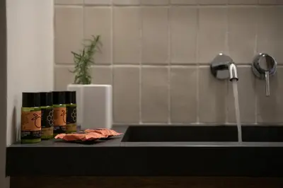 a kitchen counter with a sink and aaucet at Velanis Ηouse, style into nature - secluded in Kissamos