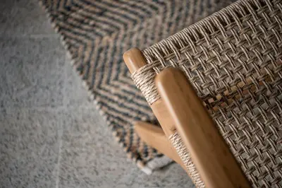 a close up of a wicker chair with a woodeninylinylinylinylinyl at Velanis Ηouse, style into nature - secluded in Kissamos
