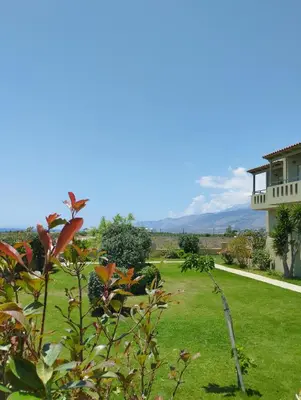 a view of a yard with a house at Argilos Apartments in Frangokastello