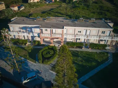 an aerial view of a large white house at Odos Oneiron Tavronitis Bay in Tavronitis