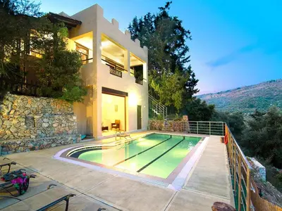 a house with a swimming pool in front of a house at Holiday home with pool in Kalamítsion Alexándrou
