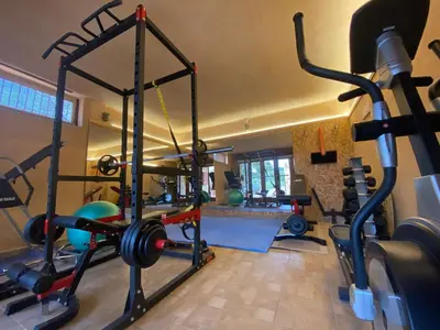 a gym with a lot of equipment in a room at ARIALKiS - ΑΡΙΑΛΚίΣ in Plataniás